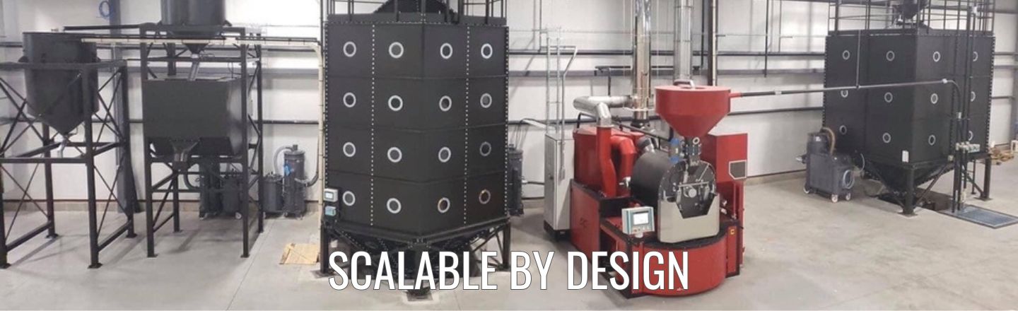 Commercial coffee roasting system with IMF roaster, storage silos and automated material handling.